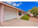 Charming single-story home featuring a well-maintained front yard and attached garage at 7302 W Cheryl Dr, Peoria, AZ 85345