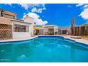 Inviting backyard featuring a sparkling blue pool, perfect for relaxing and entertaining at 7302 W Cheryl Dr, Peoria, AZ 85345