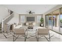 Bright living room featuring neutral decor, large windows, and seamless access to the outdoors at 9743 E Torino Ave, Mesa, AZ 85212
