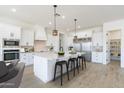 A kitchen featuring white cabinets, a large center island, stainless steel appliances, and a convenient pantry at 13929 E Barwick Dr, Scottsdale, AZ 85262