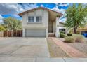 Home exterior with a two car garage and a covered front entrance with landscaping at 1929 E Redfield Rd, Phoenix, AZ 85022