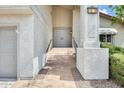 Front entrance featuring tile stairs leading to a front door with a house number at 1929 E Redfield Rd, Phoenix, AZ 85022