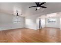 Spacious living room with hardwood floors and ceiling fans at 2256 W Ella St, Mesa, AZ 85201