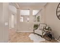 Cozy sitting room with neutral tones, decorative niches, and tile flooring at 3044 E Trigger Way, Gilbert, AZ 85297