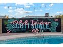 Artistic 'Old Town Scottsdale' mural near the pool, adding a touch of local flair at 7729 E Catalina Dr, Scottsdale, AZ 85251