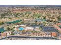 Panoramic aerial view of the community showcasing the golf course, tennis courts, pool, and residential area at 8541 W Rosemonte Dr, Peoria, AZ 85382