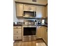 Well-equipped kitchen showcasing stainless steel appliances and ample cabinet space for storage at 8541 W Rosemonte Dr, Peoria, AZ 85382