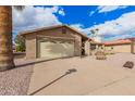 Inviting home with a spacious driveway and attached garage, offering ample parking at 980 Leisure World --, Mesa, AZ 85206