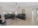 Spacious living room featuring high ceilings, wood floors, and stylish furnishings creating a comfortable ambiance at 10256 W Appaloosa Trl, Casa Grande, AZ 85194