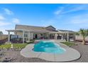 Sparkling pool, hot tub, and covered patio area for relaxing or entertaining in your own backyard retreat at 10256 W Appaloosa Trl, Casa Grande, AZ 85194