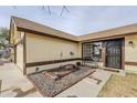 Cozy home exterior showcasing a desert landscape, a charming bench, and a well-maintained entrance at 126 S Rita Ln, Chandler, AZ 85226