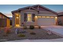 Inviting exterior showcasing desert landscaping and a two-car garage at 12660 E Pivot Peak --, Gold Canyon, AZ 85118