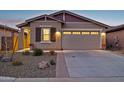 Well-maintained home featuring a two-car garage and desert landscaping at 12660 E Pivot Peak --, Gold Canyon, AZ 85118