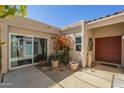 Charming front patio with tiled flooring and desert landscaping at 14266 N 2Nd Ave, Phoenix, AZ 85023