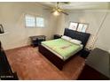 Cozy bedroom featuring a large bed, side tables, and a ceiling fan for added comfort at 150 S Windsor -- # A143, Mesa, AZ 85204