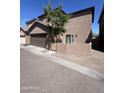 This home has a two-car garage, stucco exterior and gravel landscaping in a quiet neighborhood at 1709 W Pollack St, Phoenix, AZ 85041