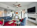 Well-lit living room features ceiling fan, fireplace, and ample wall space for decorations at 2302 N Central Ave # 412, Phoenix, AZ 85004