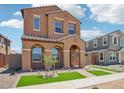 Beautiful two-story home with manicured lawn and tiled roof entryway at 26029 N 23Rd Ave, Phoenix, AZ 85085