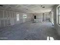 Spacious, unfinished great room area featuring bright windows at 26029 N 23Rd Ave, Phoenix, AZ 85085