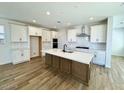 Modern kitchen featuring an island, stainless steel appliances, and ample cabinet space at 26029 N 23Rd Ave, Phoenix, AZ 85085