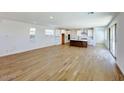 Bright, open-concept living space with wood-style flooring and modern finishes at 26029 N 23Rd Ave, Phoenix, AZ 85085