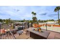 Spacious rooftop deck with a fire pit and panoramic neighborhood views at 2637 E Beekman Pl, Phoenix, AZ 85016