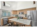 Bright kitchen featuring stainless steel appliances, granite countertops, and ample cabinet space at 3037 S Coyote Cyn, Mesa, AZ 85212