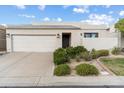 Inviting single-story home with a two-car garage, desert landscaping, and a quaint front entrance at 3038 E Marlette Ave, Phoenix, AZ 85016