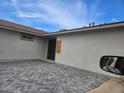 Charming single-story home with a unique front door and beautiful brick driveway at 4002 N 58Th Dr, Phoenix, AZ 85031