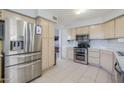 Modern kitchen with stainless steel appliances, ample counter space, and tile flooring at 4033 E Wildcat Dr, Cave Creek, AZ 85331