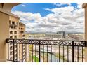 Balcony view highlighting the city skyline, nearby building, and lush green spaces at 7175 E Camelback Rd # 1106, Scottsdale, AZ 85251