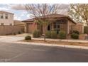 Charming single-story home with a well-manicured front yard, covered porch and a two-car garage at 10617 E Durant Dr, Mesa, AZ 85212