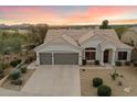 Charming home features a well-manicured yard, mature landscaping, and a spacious three-car garage at 11322 N 118Th Way, Scottsdale, AZ 85259