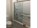 Bathroom featuring white subway tile, glass shower door and chrome fixtures at 1717 W Pollack St, Phoenix, AZ 85041