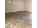 Spacious, light-filled living room featuring neutral paint and ceramic tile flooring at 1717 W Pollack St, Phoenix, AZ 85041