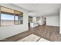 Spacious living area flows into a modern kitchen, creating an open and inviting space at 17216 W Sunward Dr, Goodyear, AZ 85338