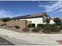 Beautiful home featuring desert landscaping, block wall fencing, and installed solar panels at 19864 W San Juan Ave, Litchfield Park, AZ 85340