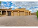 Spacious three car garage with large driveway and mature landscaping at 2005 N Pomelo --, Mesa, AZ 85215