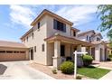 Lovely home with a spacious driveway leading to a two-car garage and an inviting porch at 2116 S Moccasin Trl, Gilbert, AZ 85295