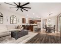 Open-concept living space with hardwood floors, stainless steel appliances, and modern fixtures at 2116 S Moccasin Trl, Gilbert, AZ 85295