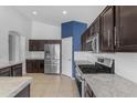 Well-equipped kitchen featuring stainless steel appliances, modern countertops, and ample cabinet space at 2882 E Indian Wells Pl, Chandler, AZ 85249
