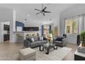 Open-concept living room with ample natural light, modern furnishings, and an inviting atmosphere perfect for entertaining at 2882 E Indian Wells Pl, Chandler, AZ 85249