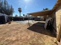 A fenced backyard with a covered patio offering ample outdoor space at 3211 W Bethany Home Rd, Phoenix, AZ 85017