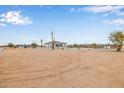 Wide view of the property featuring desert landscaping and clear demarcation by installed fence lines at 33608 W Campbell Ave, Tonopah, AZ 85354