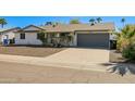 Charming single-story home with a two-car garage and extended driveway at 3619 E Friess Dr, Phoenix, AZ 85032