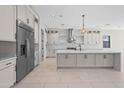 Bright kitchen featuring stainless appliances, a large island, and plenty of cabinetry at 4409 N 32Nd St, Phoenix, AZ 85018