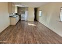 Inviting living room with modern floors, neutral walls, and abundant natural light next to the bright kitchen at 549 E Mckellips Rd # 55, Mesa, AZ 85203