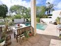 Beautifully landscaped backyard featuring a pool, patio, and comfortable seating arrangements at 6841 N 3Rd Pl, Phoenix, AZ 85012