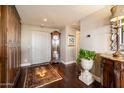 Inviting foyer with rich hardwood floors, decorative rug, and elegant furniture pieces at 1040 E Osborn Rd # 1801, Phoenix, AZ 85014