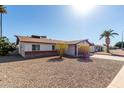 Expansive gravel front yard with mature landscaping in this lovely single-story home at 1215 W Dublin St, Chandler, AZ 85224